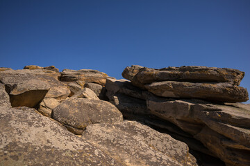 an array of sandstone stones on a sunny day