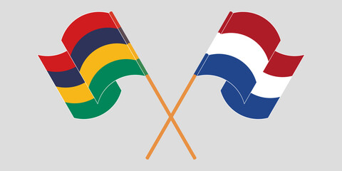 Crossed and waving flags of Mauritius and the Netherlands