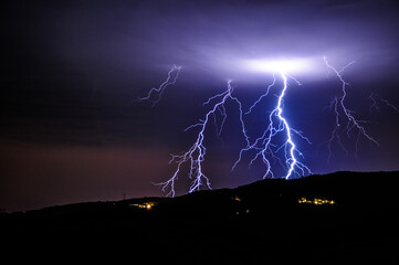 Lightning above the hills in Tuscany, Italy