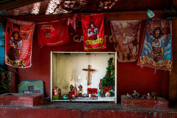 Shrine of Gauchito Gil with offerings from believers in La Boca neighborhood
