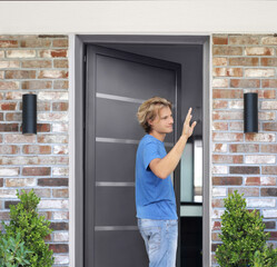 Man opening the door .Inviting the guests