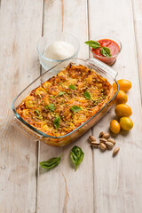 lasagne with mozzarella fresh tomatoes and pistachio nuts