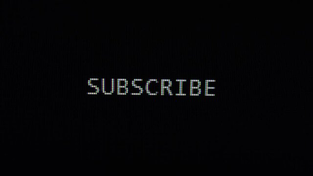 Typing of phrase Subrscribe on black background. Close up view 4K. Subscribe to our channel. Social media membership.