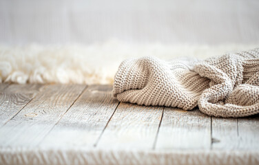 Background with a cozy knitted sweater, space for text.