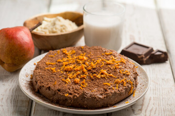 chocolate cake with pear milk and orange grated peel