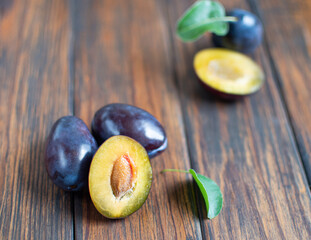 fresh plums on a wooden table