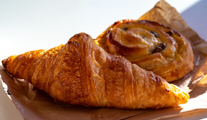 French breakfast in bakery served outdoor, fresh baked croissants and sweet pastry, morning food