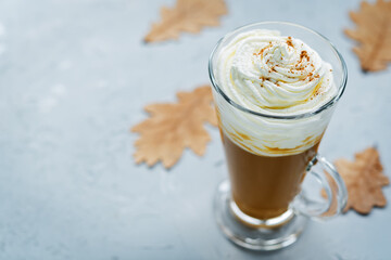 Pumpkin spice latte with whipped cream and cinnamon