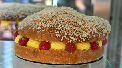 French fresh baked sweet filled brioche pastry tarte tropezienne in confectionery shop in Saint-Tropez, Provence, France