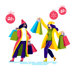 Happy girls holding shopping bags after holiday sales and special offers