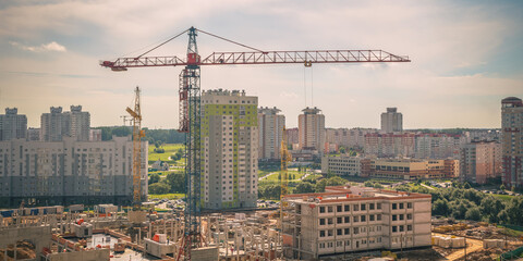 top view on construction site with crane and unfinished cement building