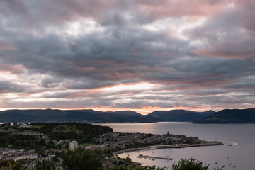 Scenic sunset view of the town and harbor of Gourock in Inverclyde in Scotland. Low light, select focus.