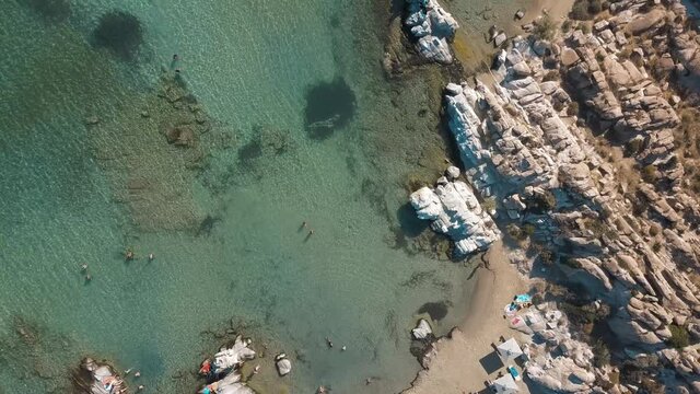 Aerial drone video of sandy beach blue sea water, clear blue sky Paros island Cyclades, Greece