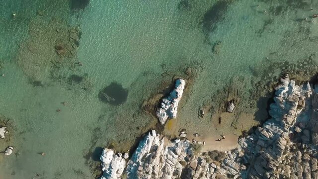 Aerial drone video of sandy beach blue sea water, clear blue sky Paros island Cyclades, Greece
