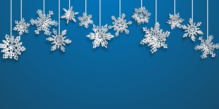 Christmas background with hanging volume paper snowflakes with soft shadows on light blue background