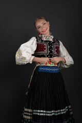 Beautiful woman wearing traditional Eastern Europe folk costumes. Slovak folk costumes.