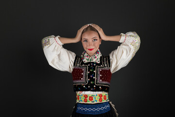 Beautiful woman wearing traditional Eastern Europe folk costumes. Slovak folk costumes.