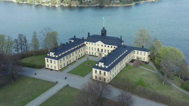 Royal Castle or palace in aerial drone shot. Surrounding by lake
