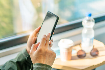 Man eat breakfast inside train bus subway public transport window view and blue seats people tourist new normal social distancing safe travel with hygiene face mask protect from covid corona virus