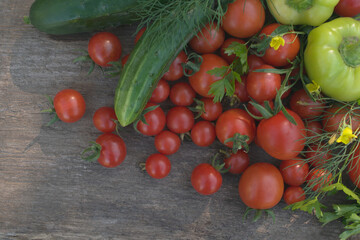 Assorted vegetables on a wooden background.