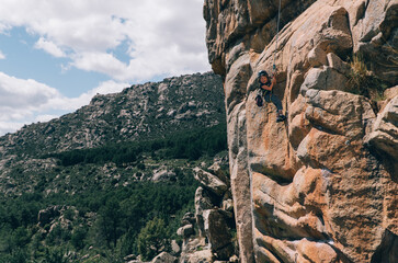 Happy Girl Doing Rock Climbing
