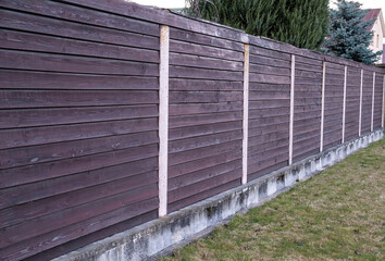 Brown wooden fence. Ptotection wooden fence. Outdoor