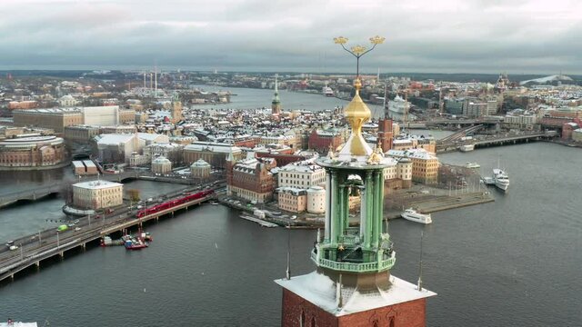 Beautiful Stockholm drone shot in winter time. Snow on stadshuset