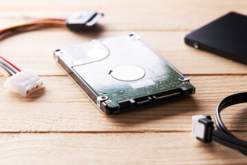 sata hard disk drive over wooden background. studio shot. recovery data conceptual. database...