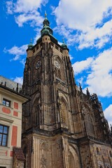 Fototapeta na wymiar Exterior of Czech Beautiful Cathedral. The Metropolitan Cathedral of Saints Vitus, Wenceslaus and Adalbert located in Prague Castle Complex. 