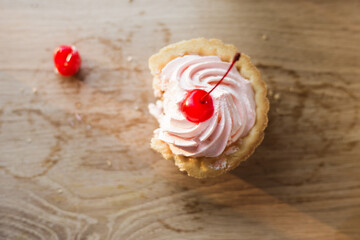 cake with cherries on the table. Flat lay top-down