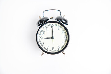 alarm clock on white 9:00