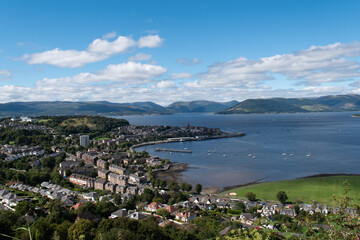 Fototapeta na wymiar Scenic view of the town and harbor of Gourock in Inverclyde in Scotland. Blue sky, sunny day in the Greenock area.