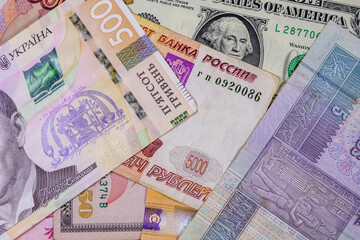 Multi currency background. Euro, american dollars, ukrainian hryvnias, egyptian pounds, russian roubles