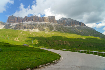 Obraz premium Mountain landscape along the road to Pordoi pass, Dolomites
