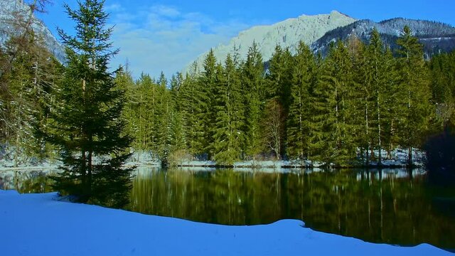 Green lake (Gruner see) in sunny winter day. Famous tourist destination for walking and trekking in Styria region, Austria