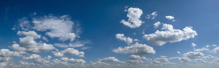 White cumulus clouds in blue sky panoramic high resolution background