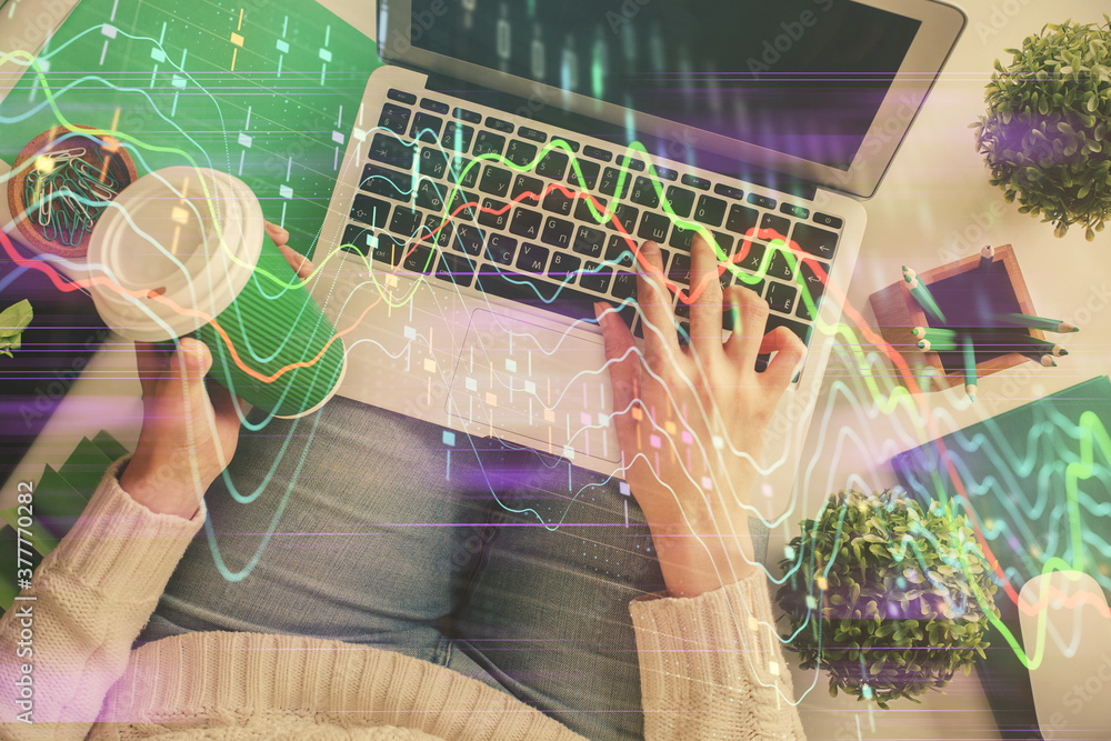 Poster double exposure of woman hands working on computer and forex chart hologram drawing. top view. finan