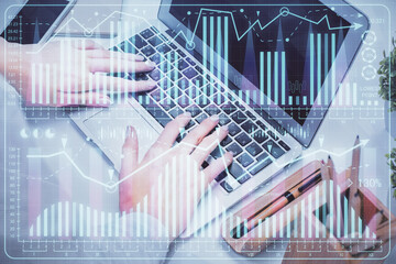 Fototapeta na wymiar Multi exposure of woman hands typing on computer and forex chart hologram drawing. Stock market analysis concept.