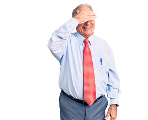 Senior handsome grey-haired man wearing elegant tie and shirt smiling and laughing with hand on face covering eyes for surprise. blind concept.