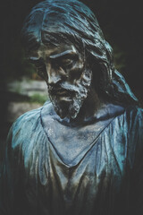Fototapeta na wymiar Ancient statue of Jesus Christ. Religion, faith, death, resurrection, eternity concept.
