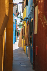 Fototapeta na wymiar Vivid colours in a Little Lane in Murano, Venice