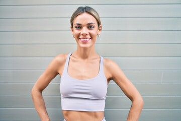 Fototapeta na wymiar Young cauciasian fitness woman wearing sport clothes training outdoors