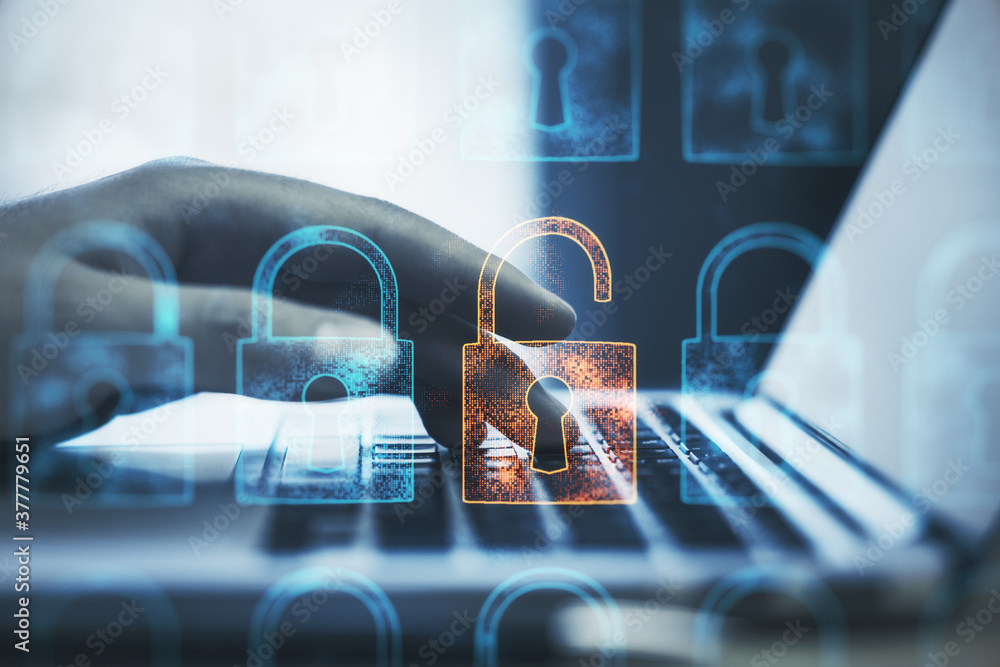 Poster hand using laptop with creative glowing digital padlock interface.