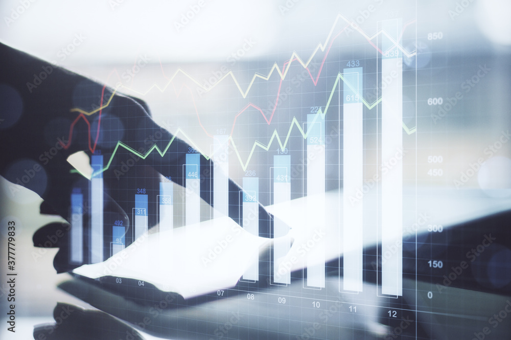 Poster hand using tablet computer on desktop with business chart hologram o