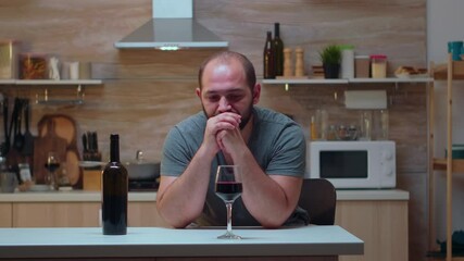 Alcoholic person with headaches trying to refrain. Unhappy person suffering of migraine, depression, disease and anxiety feeling exhausted with dizziness symptoms having alcoholism problems.
