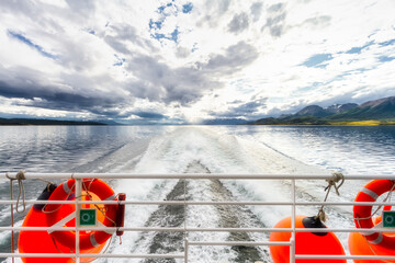 Water trail in the Beagle Channel seen from the stern of a ferry boat