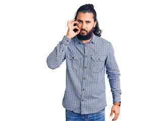 Young arab man wearing casual clothes mouth and lips shut as zip with fingers. secret and silent,...