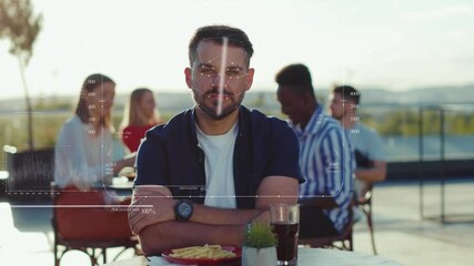 Portrait of handsome man sitting in outdoor cafe Animation 3d recognition scanning mask of the face eye of man look at camera smiling happy restaurant businessman relaxed slow motion - Powered by Adobe