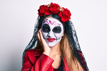 Woman wearing day of the dead costume over white thinking looking tired and bored with depression problems with crossed arms.