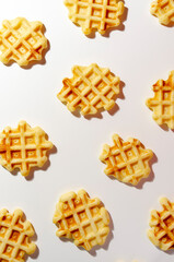 Waffle texture. Wafer pieces isolated on white background.